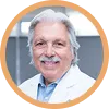Dr. Francisco Contreras, director of Oasis of Hope Hospital, in professional medical attire.